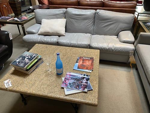 Leather Sofa Top Grain Italian Leather Dove Gray - $799
Granite and Steel Cocktail Table Blacksmith Finish - $399